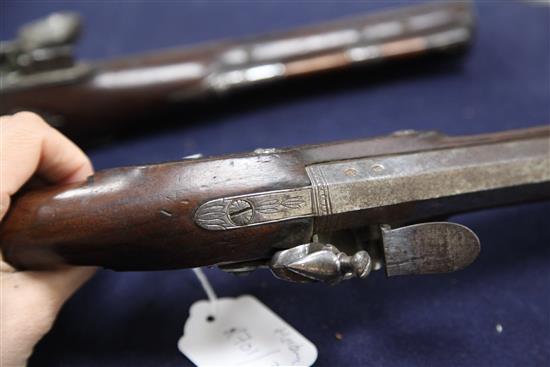A pair of late 18th century flintlock holster pistols, 15in.